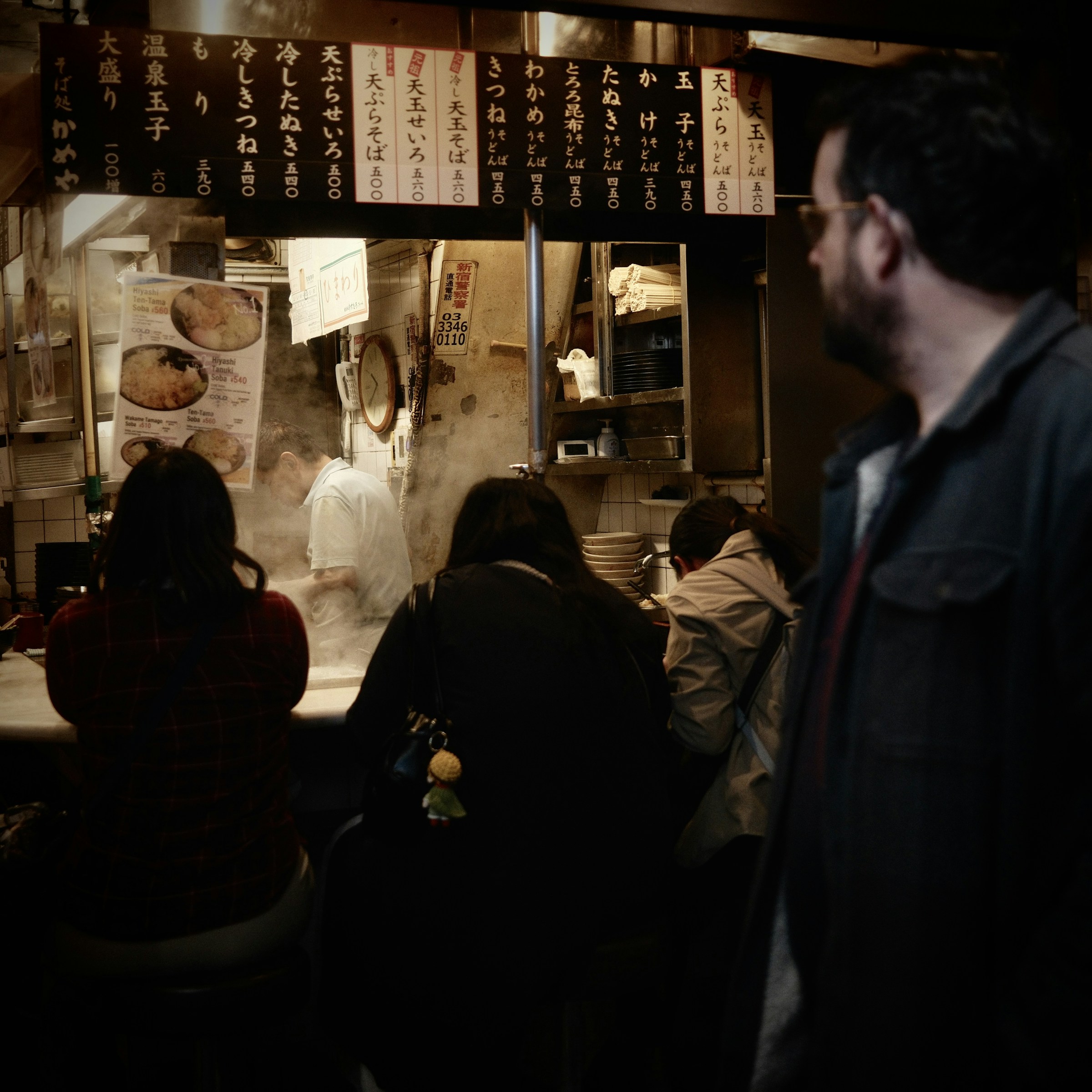 Night market alley with street food vendors in Tokyo