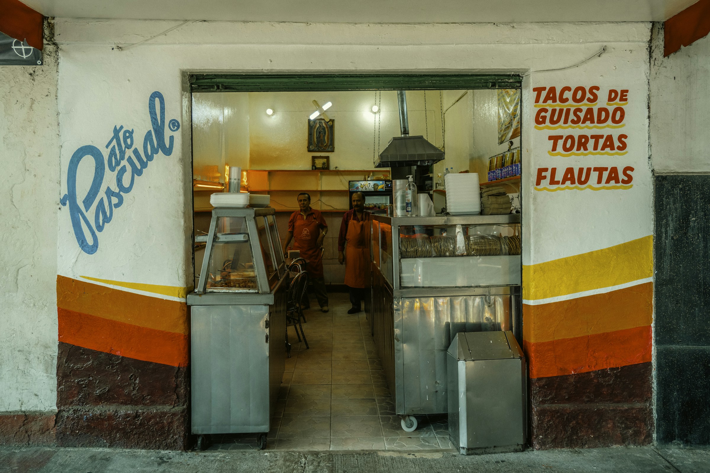 Taco shop entrance on a street in Mexico City